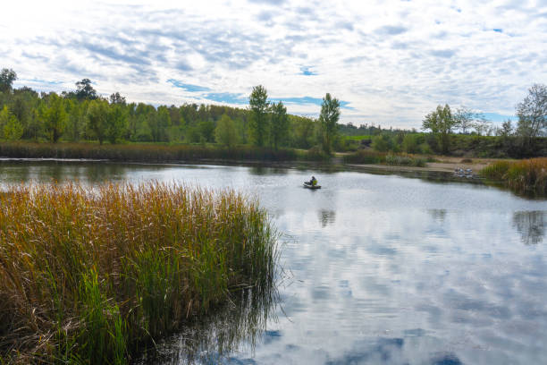 istock Fisherman on the lake beautiful landscape 1431915308
