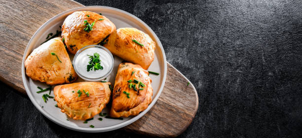 istock Composition with a plate of oven-baked pierogi 1431916942