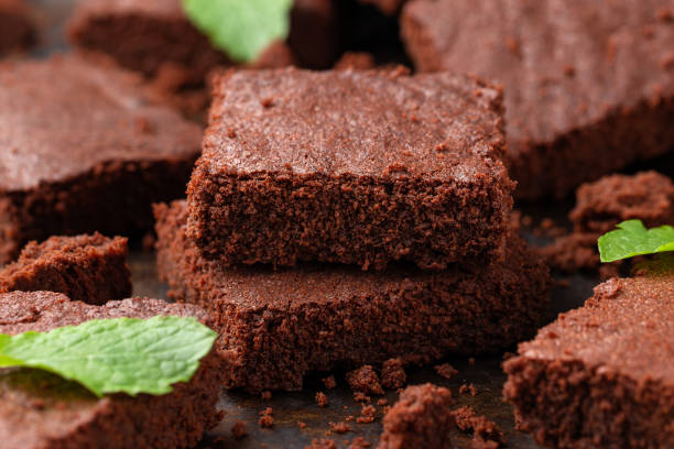 istock Chocolate brownies garnished with mint. Sweet food 1431918511