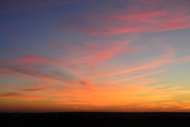 istock red, purple and yellow clouds on the evening sky, close-up 1431919418