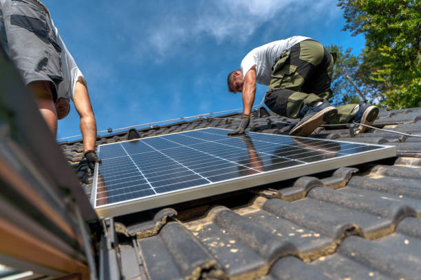 istock Men worker installing solar photovoltaic panels on roof, alternative energy, saving resources and sustainable lifestyle concept. 1431920892