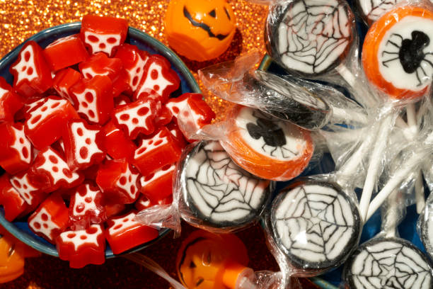 istock halloween lollipops and candies on a bright orange background 1431925112