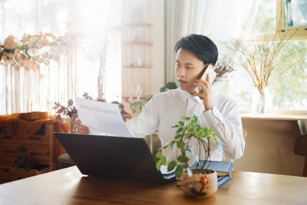 istock A young Asian man works from home office, telecommuting concept, flexible lifestyle 1431925300
