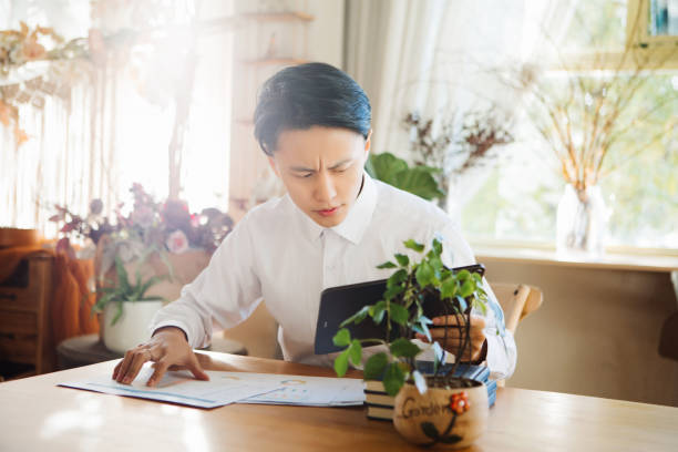 istock A young Asian man works from home office, telecommuting concept, flexible lifestyle 1431925461