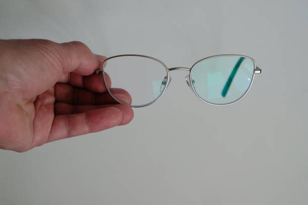 istock Classic computer protective eyewear in the hand of an old woman. 1431928677