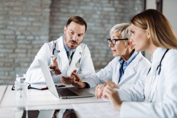 istock Medical experts  working on laptop at doctor's office 1431933102