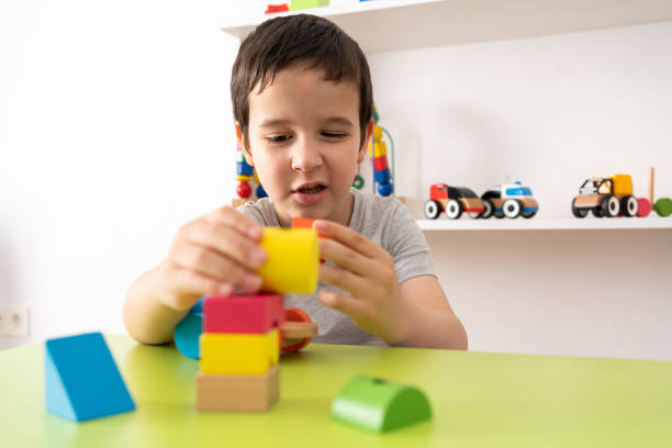 istock Child playing with colourful educational toy blocks 1431933205