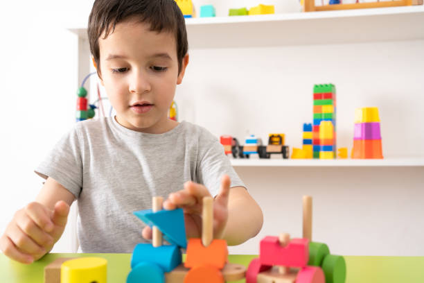 istock child playing with wooden toy 1431933248