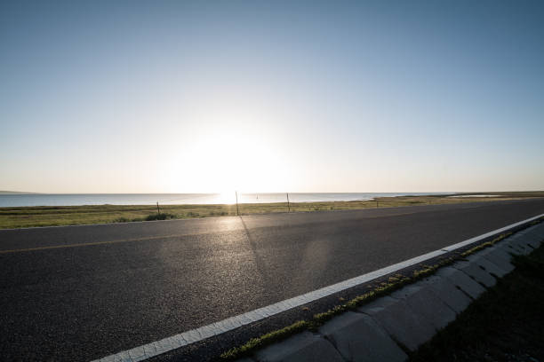istock Road beside qinghai lake at morning 1431936478