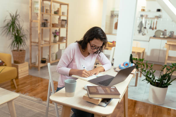 istock Beautiful young woman working from her home office 1431938937