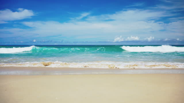 Sea sky clouds. Sand sea water turquoise. Wave with white foamy coastline .
