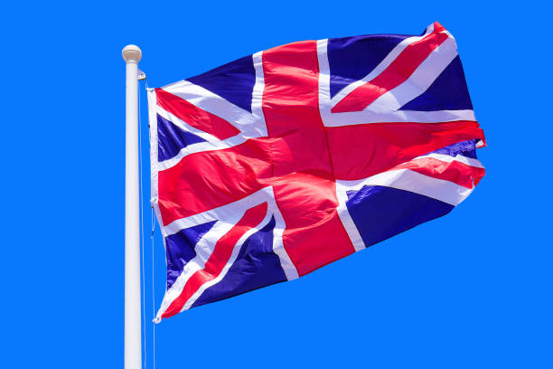 istock Flag UK on blue sky background 1431942451
