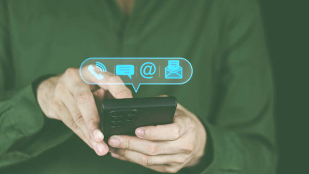 istock Customer support hotline Contact concept Customer service representative's hands are filling out information from mobile phone to computer. and notify the contact address to the service use 1431942519