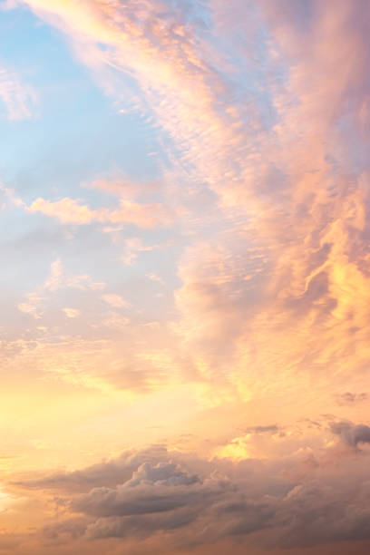 istock Sky texture with beautiful clouds, light from the sun at dawn, vertical view 1431943561