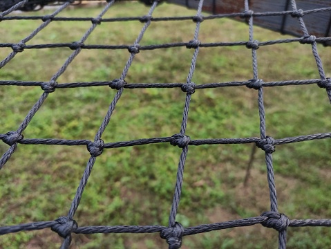 The nets are woven together to form a piece of cloth for the sleeping area.