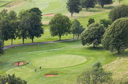 Buckinghamshire, UK - July 07, 2021. Golfers, group of men playing golf on a course in English countryside