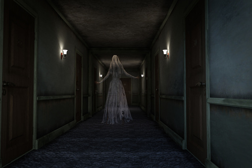 Ghostly figure of woman in wedding dress floating along a creepy hotel hallway. 3D rendering.