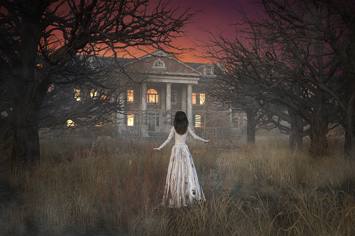Ghostly figure of woman in long white dress floating through forest towards a creepy haunted mansion house. 3d illustration.