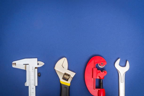 istock Big set of tools on blue background prepared by professional master before repair or construction 1431953766