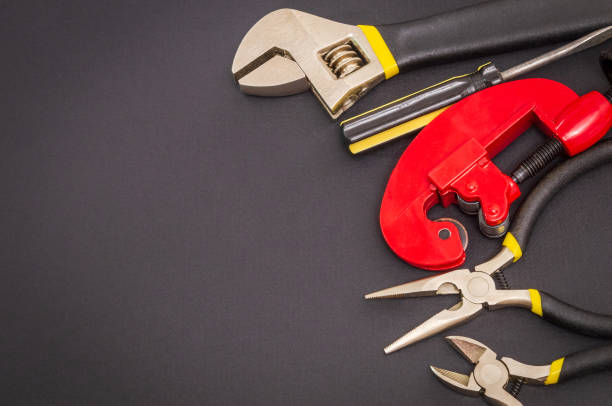 istock Big set of tools on black background prepared by the master before repair or construction 1431957358
