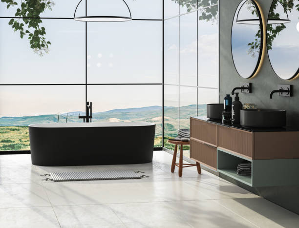 istock Modern minimalist bathroom interior with dark green wall, luxury bathroom cabinet with double sink, interior plants, bathtub, countertop, forest view from window. Cozy bathroom design. 3D Render 1431960446