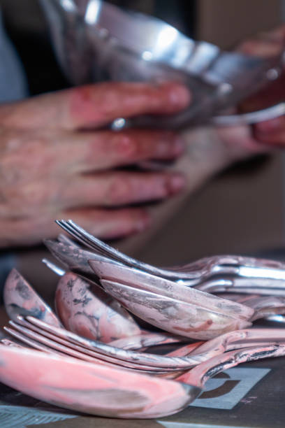 Hand polishing silverware