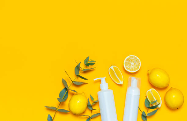 istock Whites Cosmetic bottle containers fresh lemon orange eucalyptus on yellow background top view flat lay copy space. Blank label for branding mock-up Natural beauty product concept Shower Gel Soap Cream 1431968717