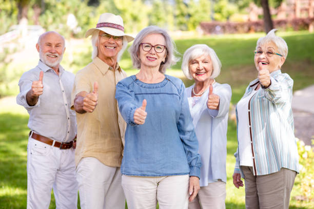 istock Group of seniors people bonding at the park 1431970564