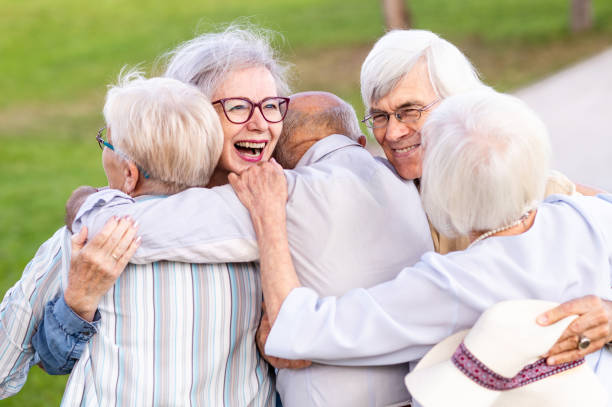 istock Group of seniors people bonding at the park 1431970633