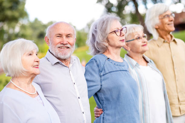 istock Group of seniors people bonding at the park 1431970857