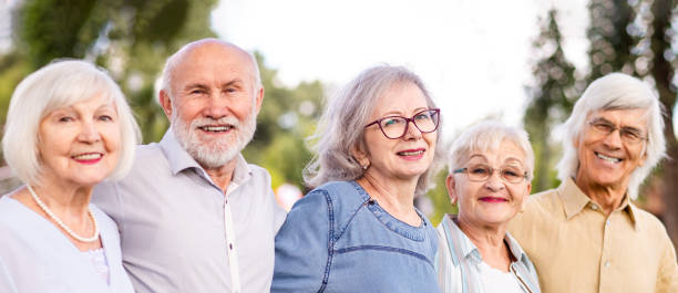 istock Group of seniors people bonding at the park 1431971053