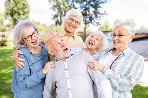 istock Group of seniors people bonding at the park 1431971661