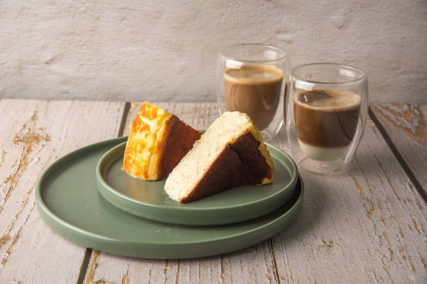 istock Sliced san sebastian cheesecake with coffee on wooden table 1431972469
