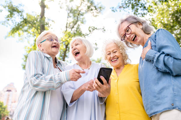 istock Group of seniors people bonding at the park 1431972843