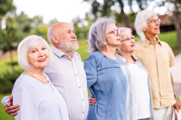 istock Group of seniors people bonding at the park 1431972964