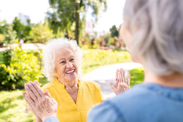 istock Group of seniors people bonding at the park 1431972986