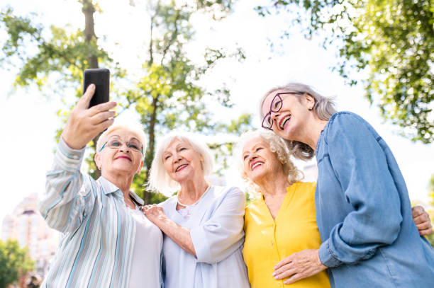 istock Group of seniors people bonding at the park 1431973020