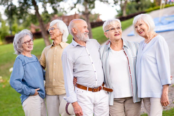 istock Group of seniors people bonding at the park 1431973064