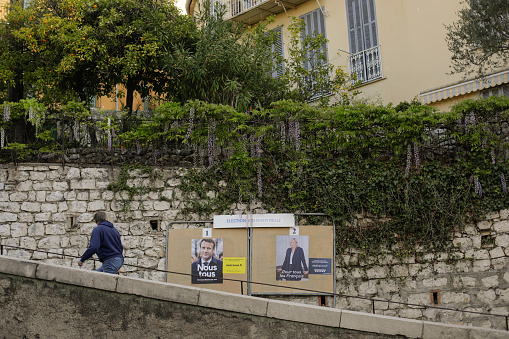 Menton, France - April 20, 2022: Electoral posters with Emmanuel Macron and Marine le Pen before the second round of presidential elections in France.