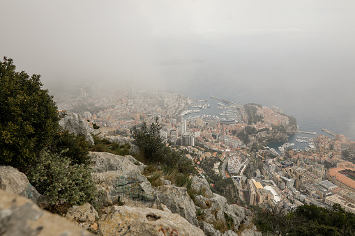 Overview with the Monaco city and port during a spring cloudy day from above, from Tete de Chien.