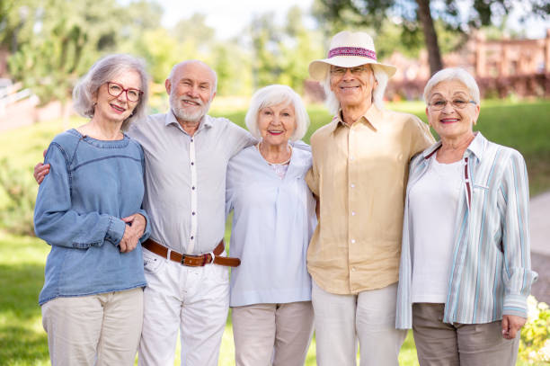 istock Group of seniors people bonding at the park 1431973256