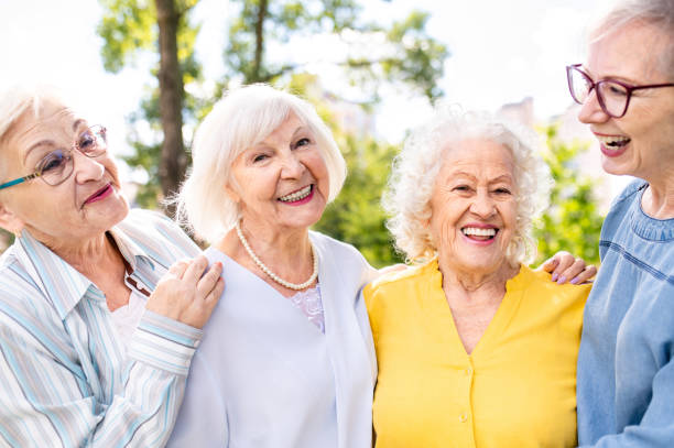 istock Group of seniors people bonding at the park 1431973324