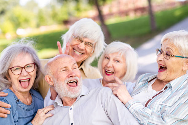 istock Group of seniors people bonding at the park 1431973494