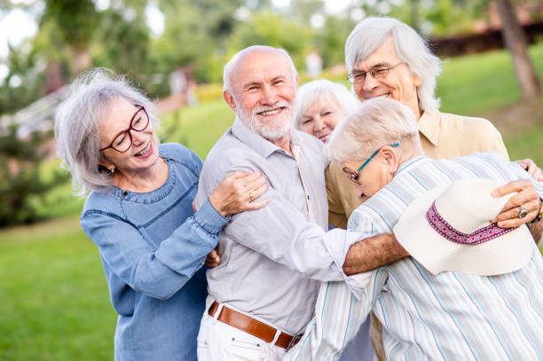 istock Group of seniors people bonding at the park 1431974046