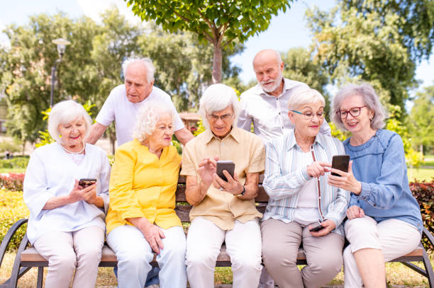 istock Group of seniors people bonding at the park 1431974130