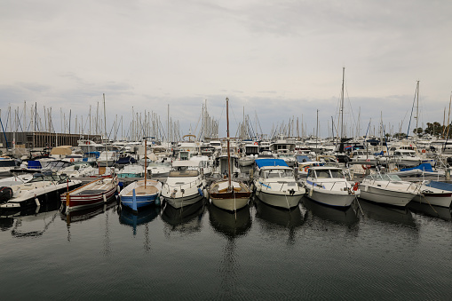 Cannes, France - April 20, 2022: Details from the marina of Cannes on the French riviera during a cloudy spring day.
