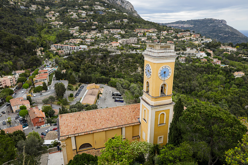 Eze, France - April 21, 2022: Overview from the coastal town of Eze on the French riviera during a cloudy spring day.