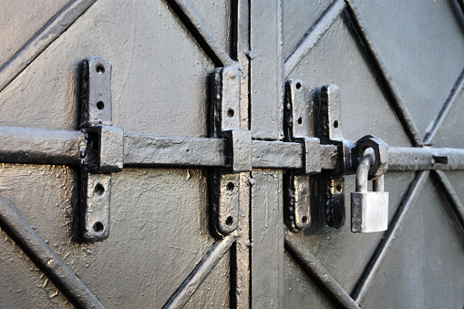 Old metal doors and lock, close-up.