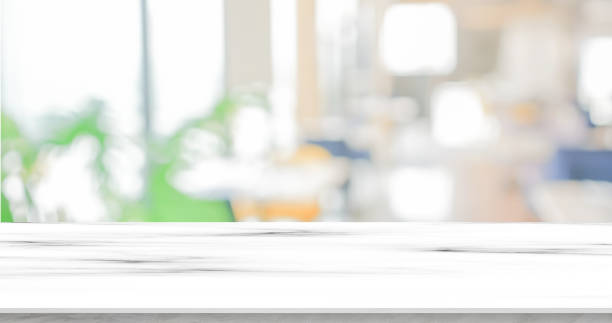 istock blurred inside of interior luxury modern bathroom in background with white marble pattern tabletop for show, promote ads and design product on display concept 1431977365