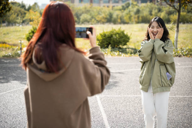 istock Two girls are taking photos 1431977537